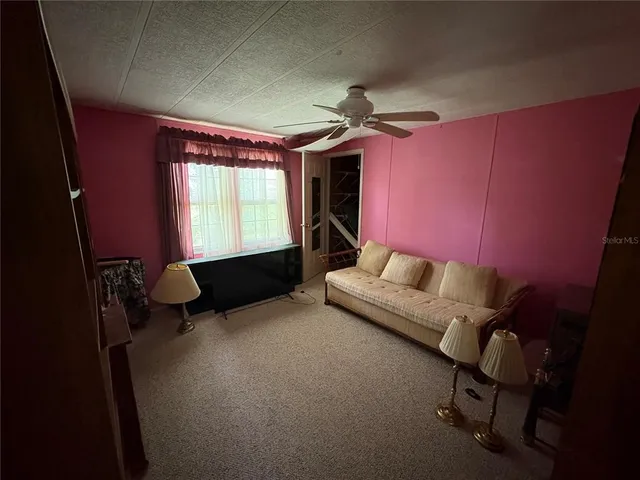 a view of empty room with windows