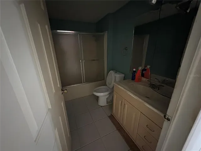 a kitchen with stainless steel appliances a sink stove and refrigerator