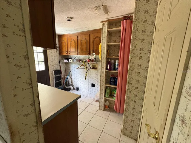 a room with furniture and a large window