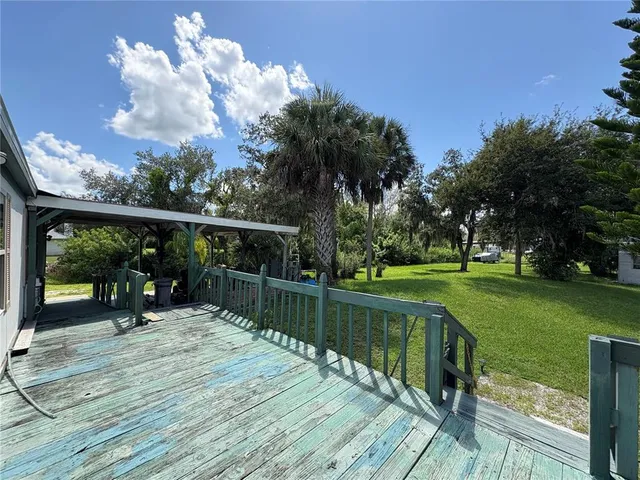 a view of a backyard with a patio