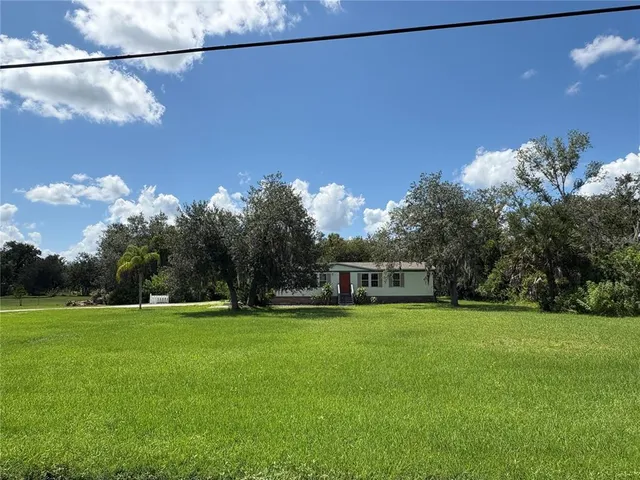 a view of a house with a big yard