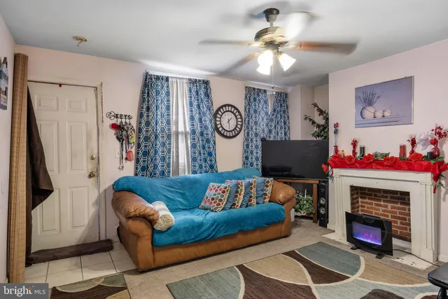 a living room with furniture and a fireplace