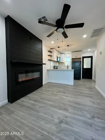 a view of a kitchen with a dishwasher and a refrigerator