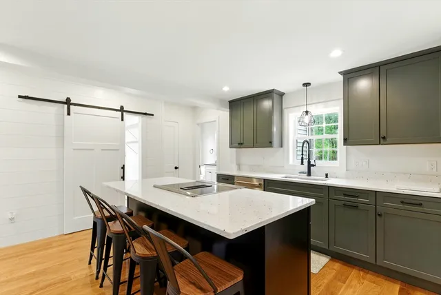a kitchen with a table and chairs in it