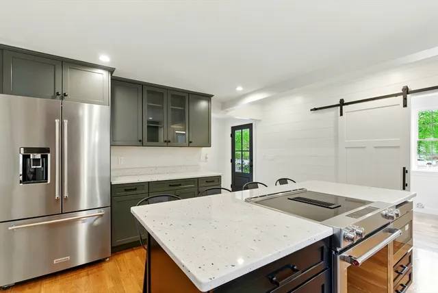 a kitchen with a refrigerator and a sink