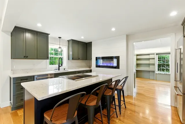 a kitchen with a table and chairs in it