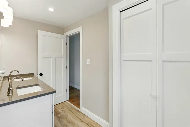 a bathroom with a sink and mirror