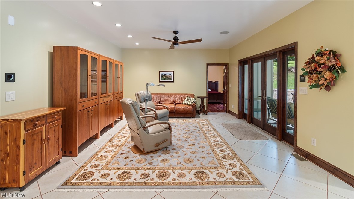 57430 Ohio Riverview Road Shadyside, OH 43947 - Photo 11 of 35 Tiled living room featuring french doors and ceiling fan