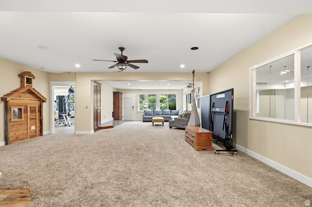 672 Perry Hollow Drive Mapleton, UT 84664 - Photo 73 of 106 Spacious lower-level area featuring plush carpeting, recessed lighting, and a ceiling fan