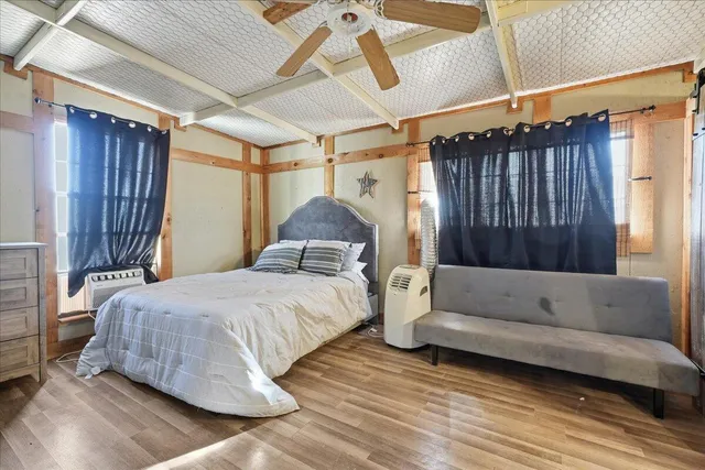 a bathroom with a granite countertop sink a mirror and a shower