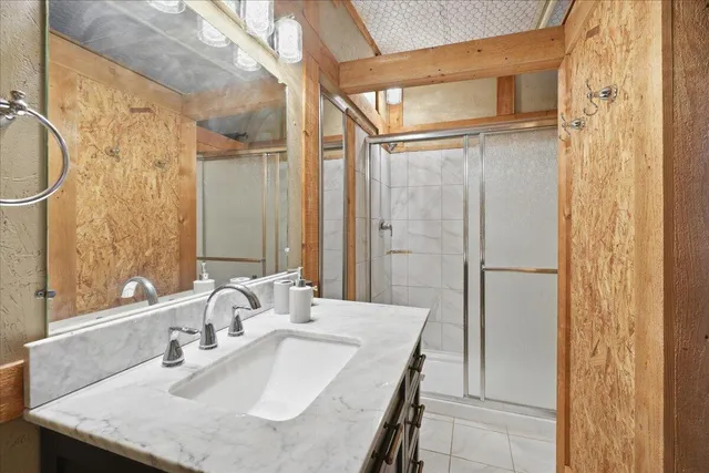 a view of a roof deck with table and chairs with wooden floor