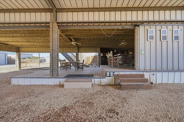 a view of a room with lots of wooden furniture