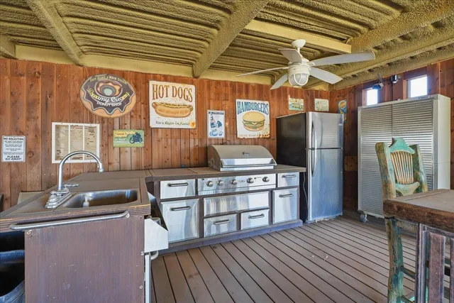 a dining room with wooden floor a table and chairs