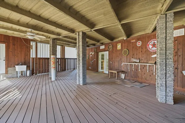 a hallway with a couch and wooden floor