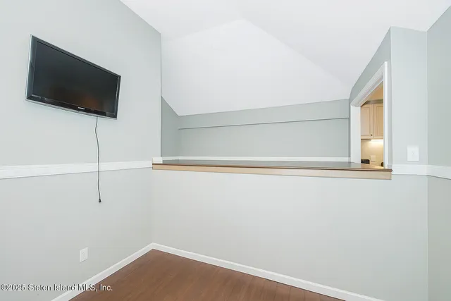 a view of a room with a flat screen tv