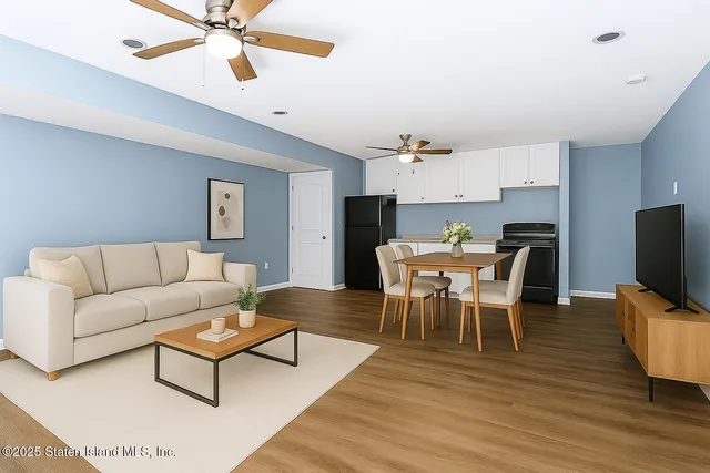 a living room with furniture a dining table and a fireplace