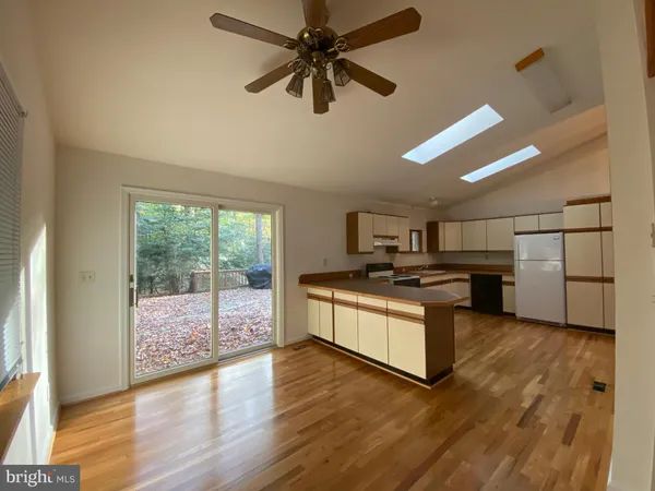 a kitchen with stainless steel appliances granite countertop a stove and a refrigerator
