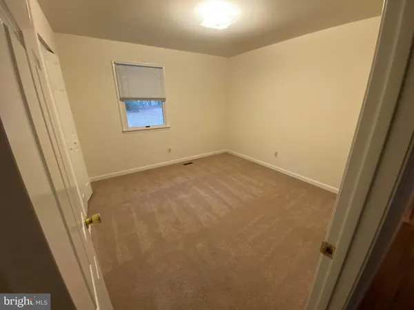 an empty room with a wooden door