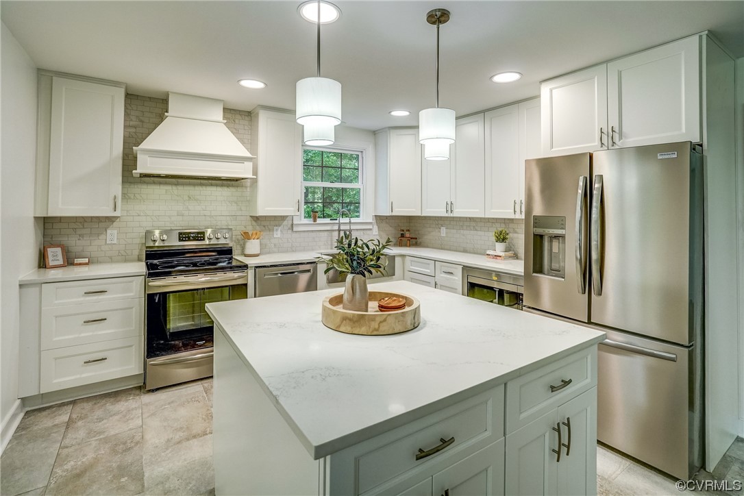 13611 Thorngate Road Midlothian, VA 23113 - Photo 11 of 49 a kitchen with white cabinets and stainless steel appliances