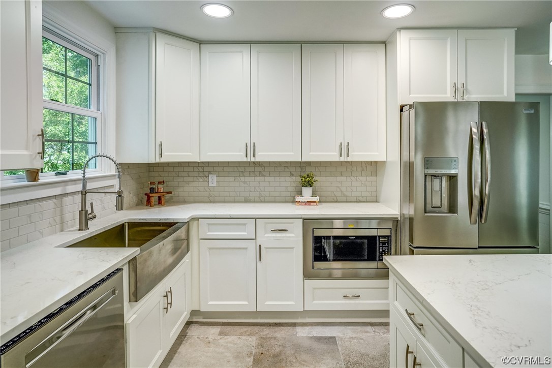 13611 Thorngate Road Midlothian, VA 23113 - Photo 12 of 49 a kitchen with a sink stove and refrigerator