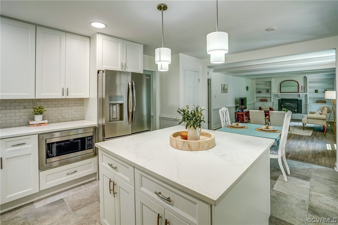 13611 Thorngate Road Midlothian, VA 23113 - Photo 13 of 49 a kitchen with a sink a stove and chairs