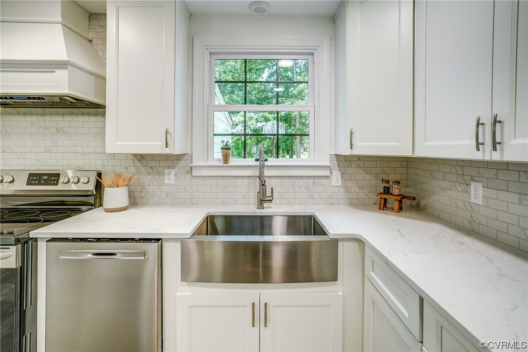 13611 Thorngate Road Midlothian, VA 23113 - Photo 15 of 49 a kitchen with a sink cabinets and window