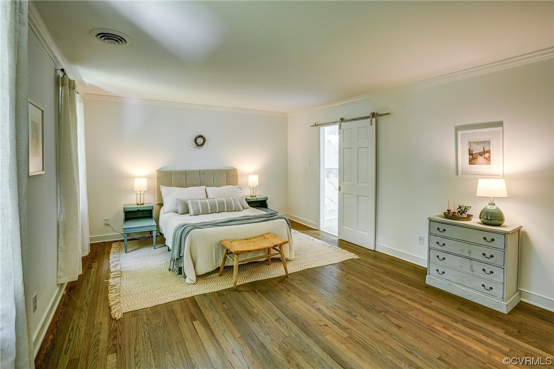 13611 Thorngate Road Midlothian, VA 23113 - Photo 26 of 49 a bedroom with a bed and wooden floor