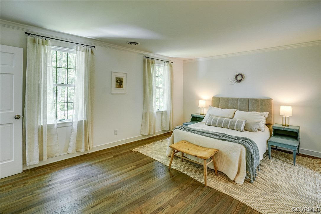 13611 Thorngate Road Midlothian, VA 23113 - Photo 27 of 49 a spacious bedroom with a bed and wooden floor