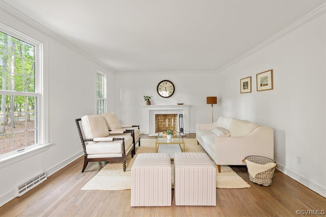 13611 Thorngate Road Midlothian, VA 23113 - Photo 3 of 49 a living room with furniture and a wooden floor