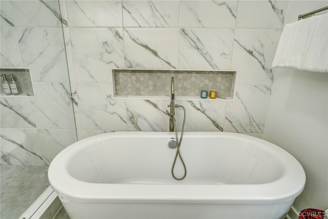 13611 Thorngate Road Midlothian, VA 23113 - Photo 32 of 49 a white bath tub sitting in a bathroom