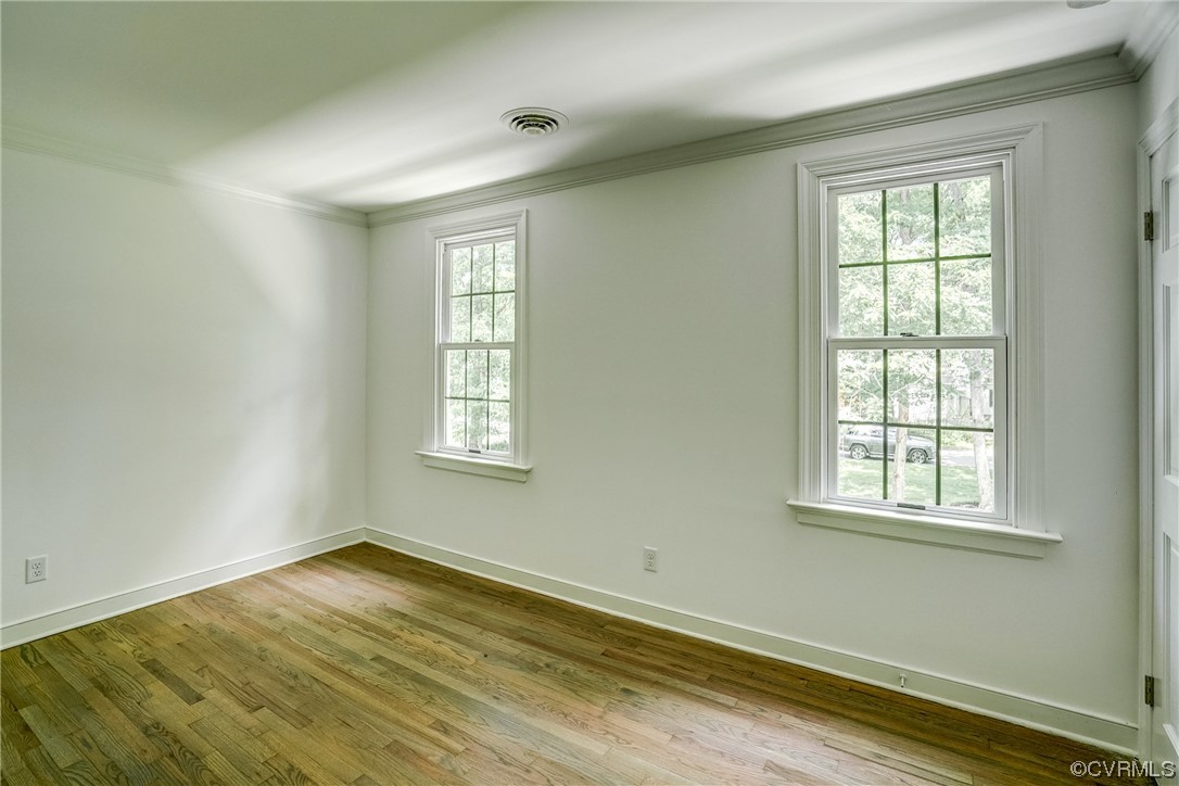 13611 Thorngate Road Midlothian, VA 23113 - Photo 40 of 49 an empty room with wooden floor and windows