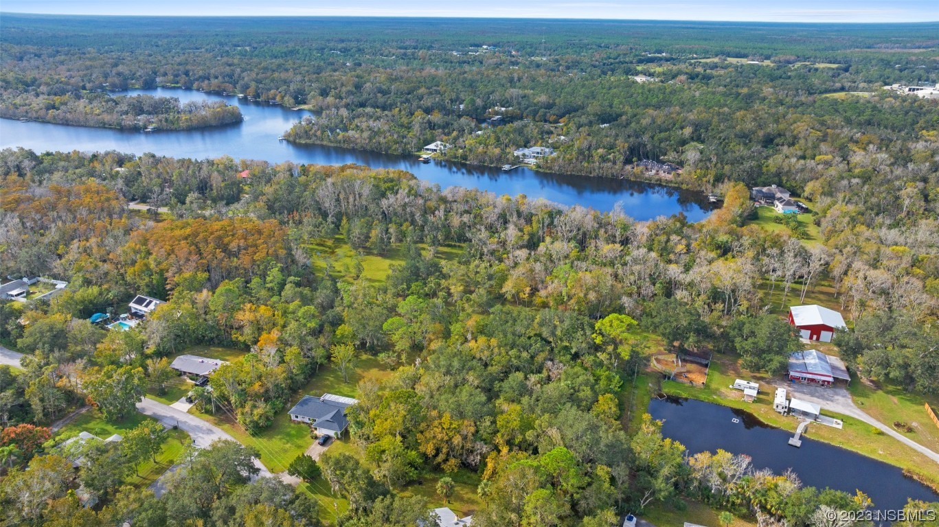 0 Bolton Road New Smyrna Beach, FL 32168 - Photo 16 of 18 an aerial view of residential houses with outdoor space and trees