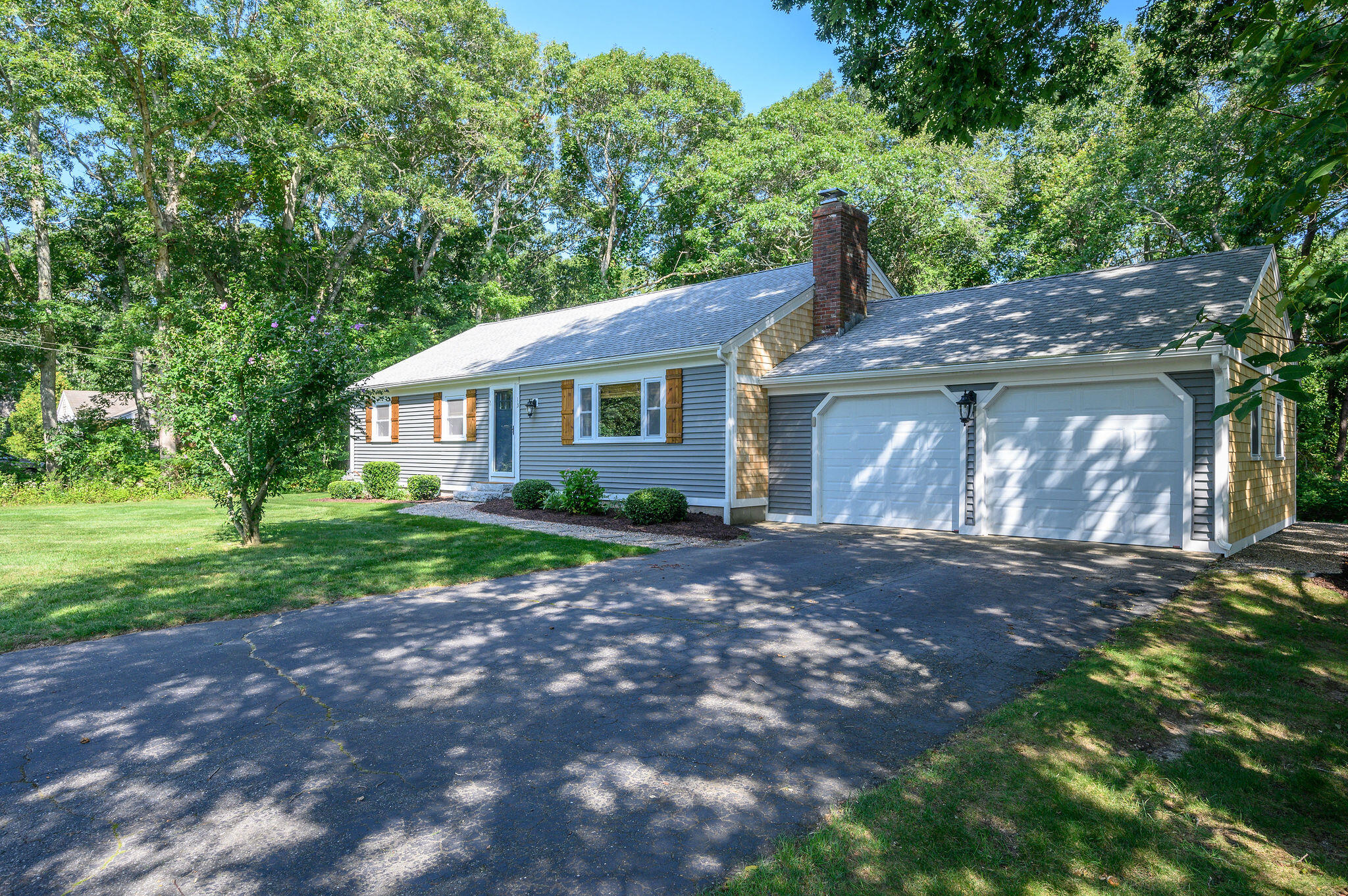 13 Crowell Road Sandwich, MA 02563 - Photo 2 of 33 a front view of a house with garden