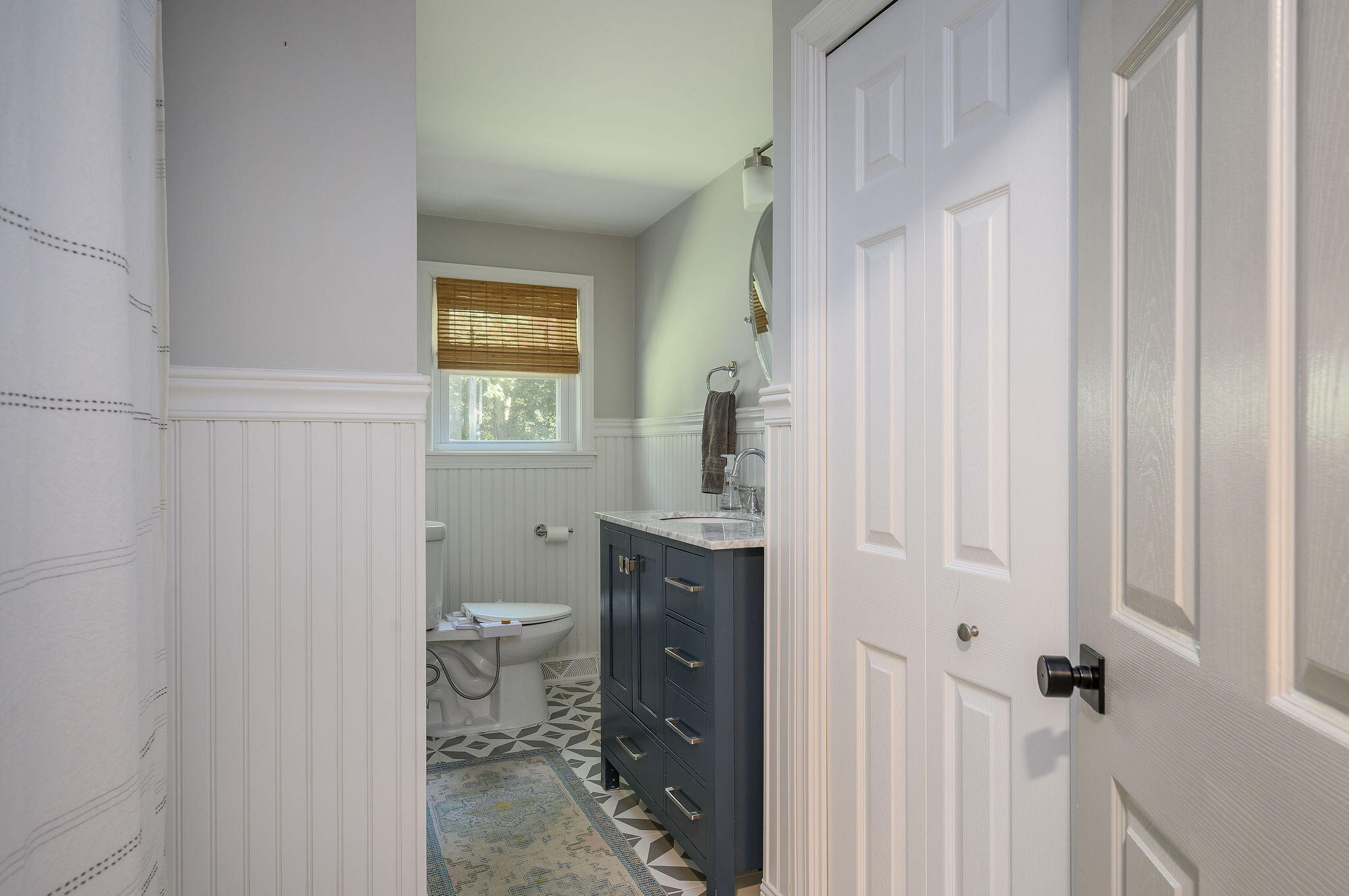 13 Crowell Road Sandwich, MA 02563 - Photo 23 of 33 a bathroom with a granite countertop sink a toilet and shower curtain