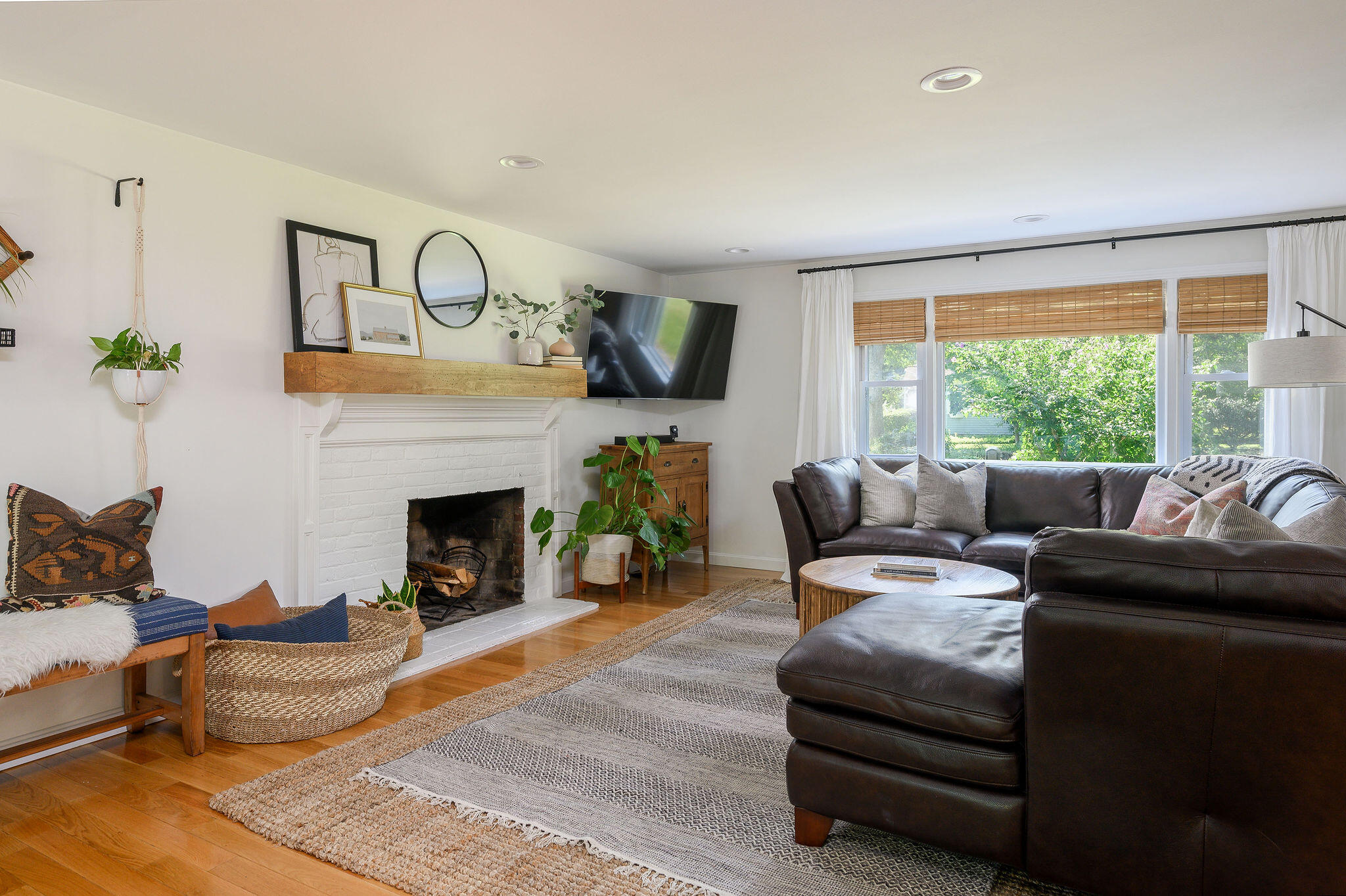 13 Crowell Road Sandwich, MA 02563 - Photo 9 of 33 a living room with furniture a fireplace and a flat screen tv