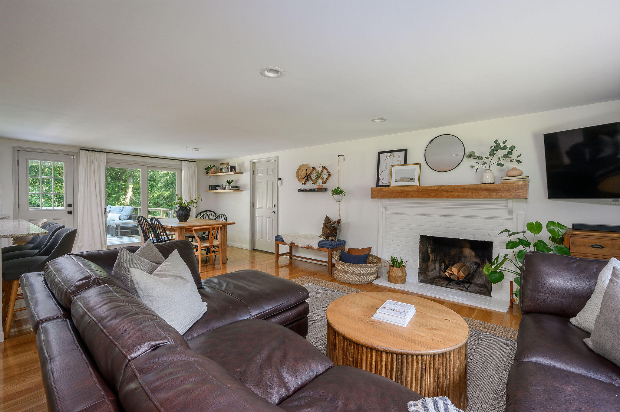 13 Crowell Road Sandwich, MA 02563 - Photo 10 of 33 a living room with furniture and a fireplace