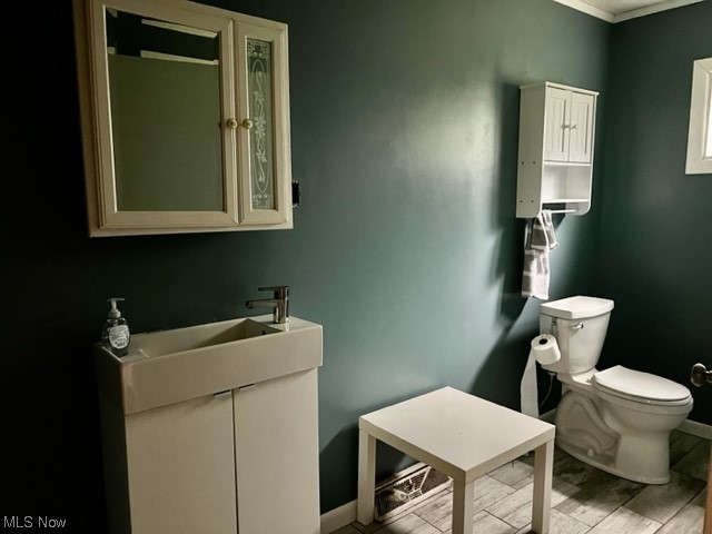 2360 Sheperds Valley Road New Cumberland, WV 26047 - Photo 12 of 16 Bathroom with vanity with extensive cabinet space, mirror, light hardwood flooring, and ornamental molding