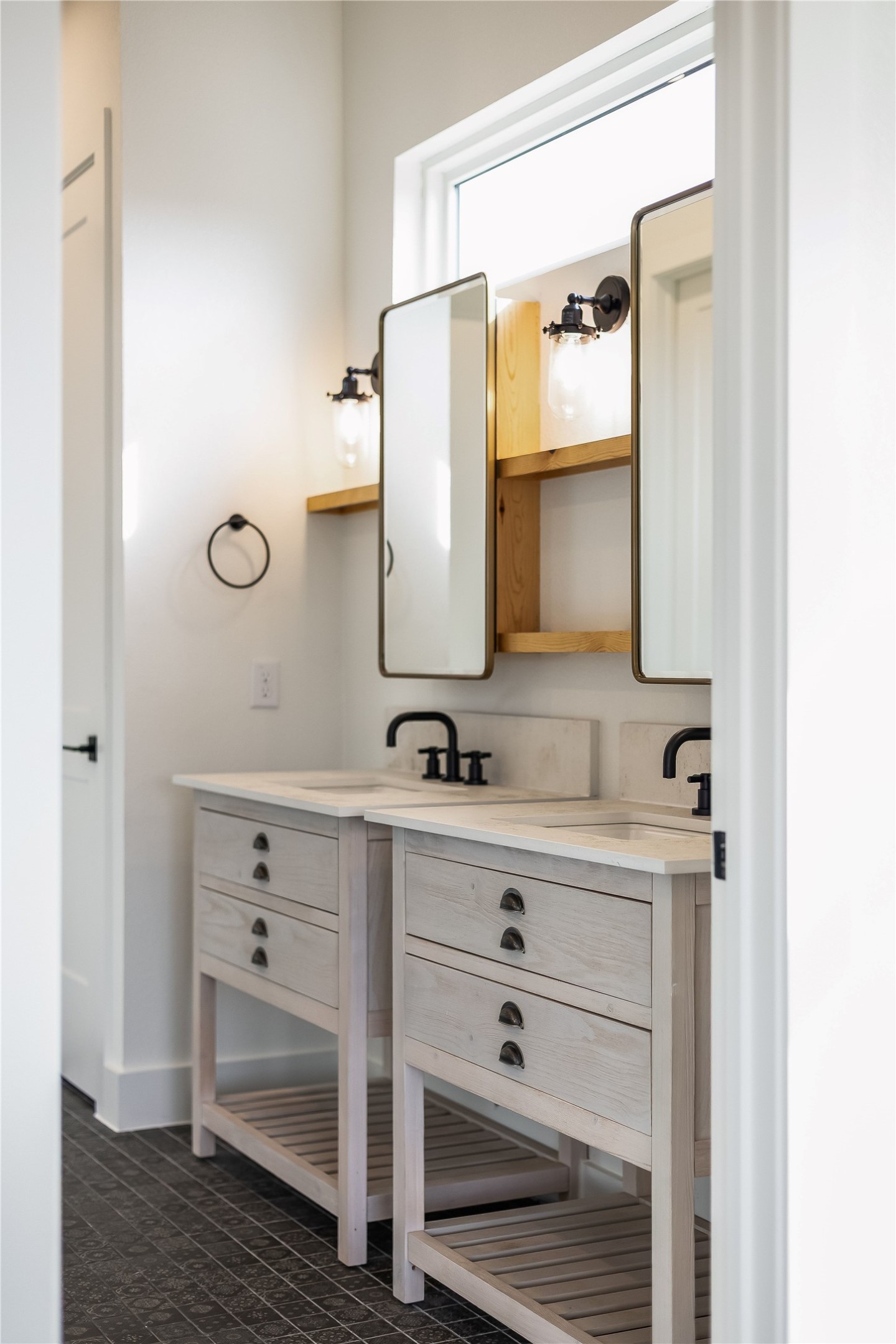 288 Smoke Tree Circle Dripping Springs, TX 78620 - Photo 14 of 40 a bathroom with a sink and a mirror