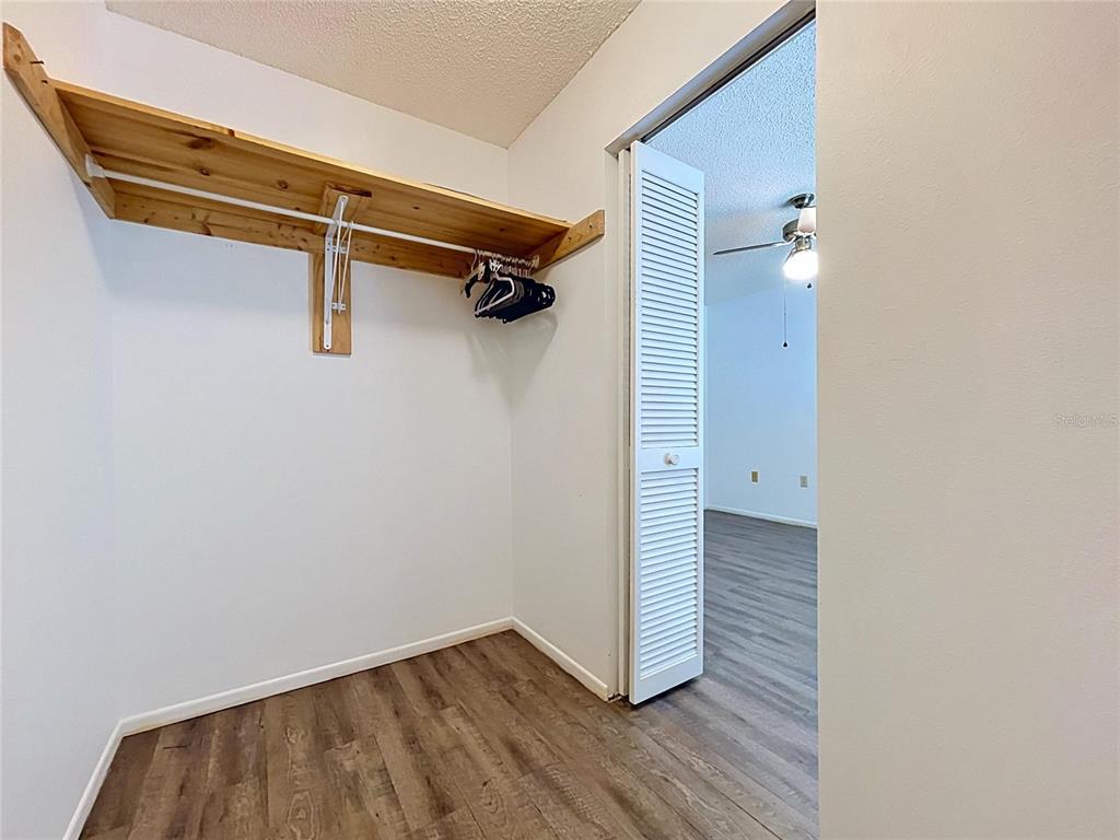 9319 Trowbridge Court New Port Richey, FL 34655 - Photo 54 of 78 a view of a room with wooden floor