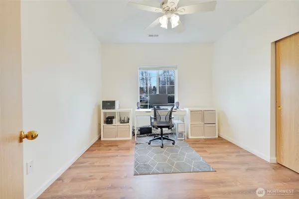 a workspace with furniture and a window
