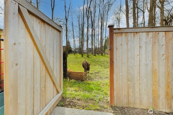 a view of a house with a yard and sitting area