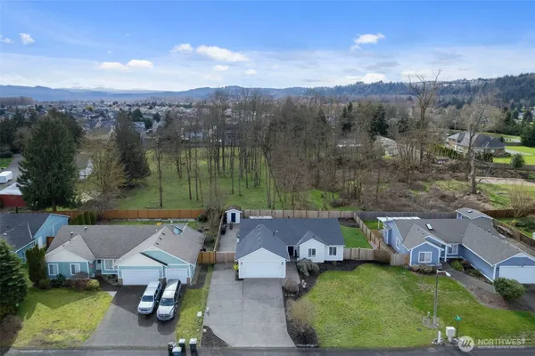 an aerial view of houses with yard