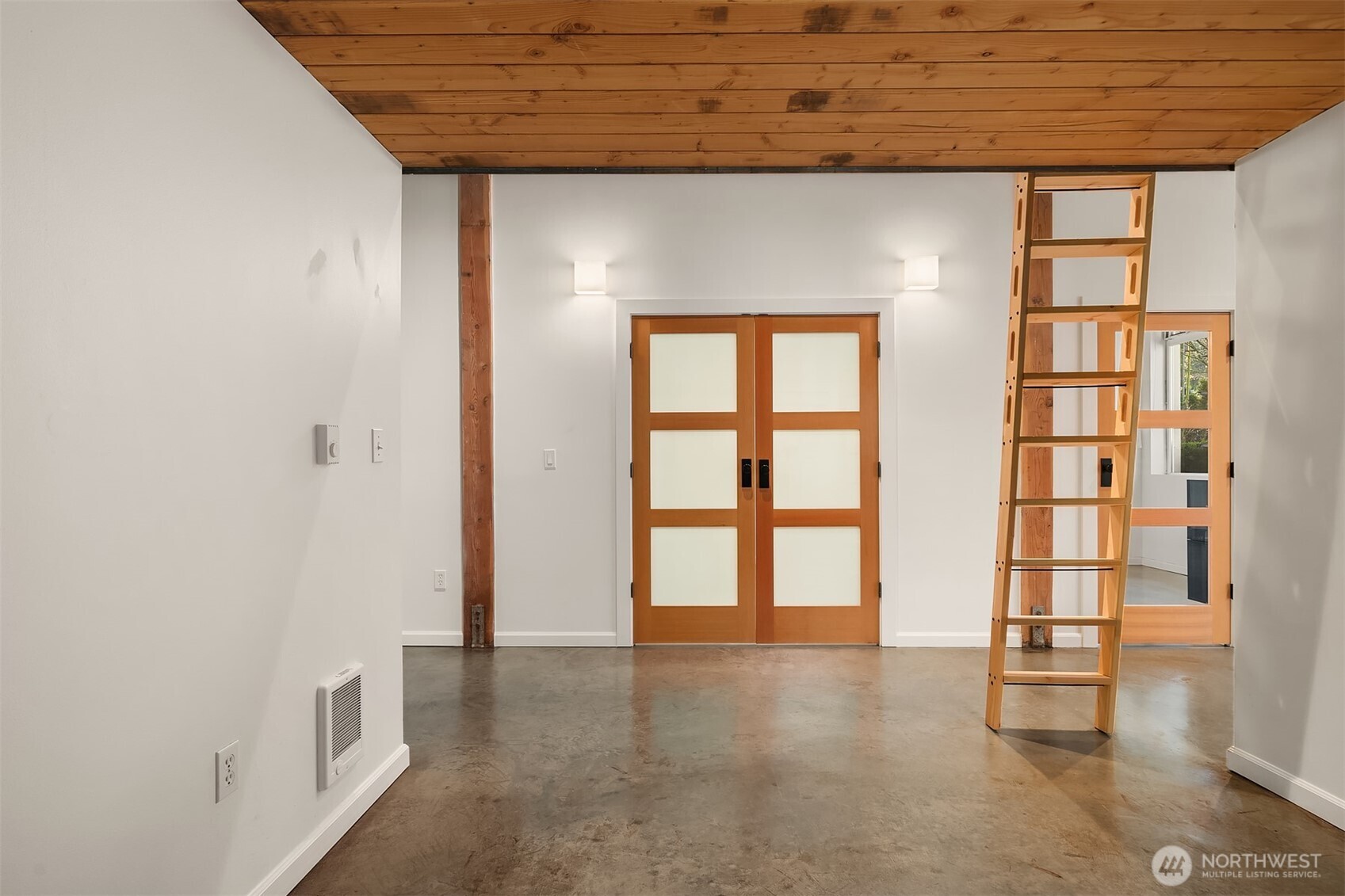 1812 19th Avenue, Unit 103 Seattle, WA 98122 - Photo 6 of 14 an empty room with windows