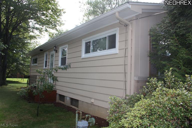 52 Kenridge Road Akron, OH 44333 - Photo 19 of 19 Left side of house. Kitchen has door that leads to outside.