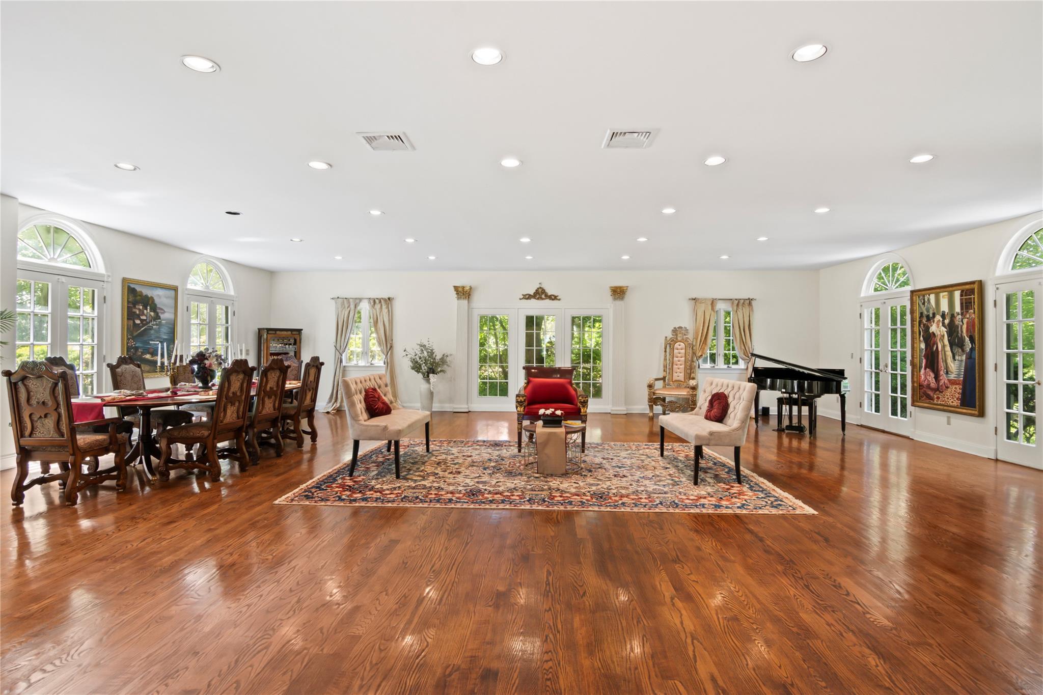 358 Centre Island Road Centre Island, NY 11771 - Photo 14 of 39 a living room with lots of furniture a large window and white stainless steel appliances