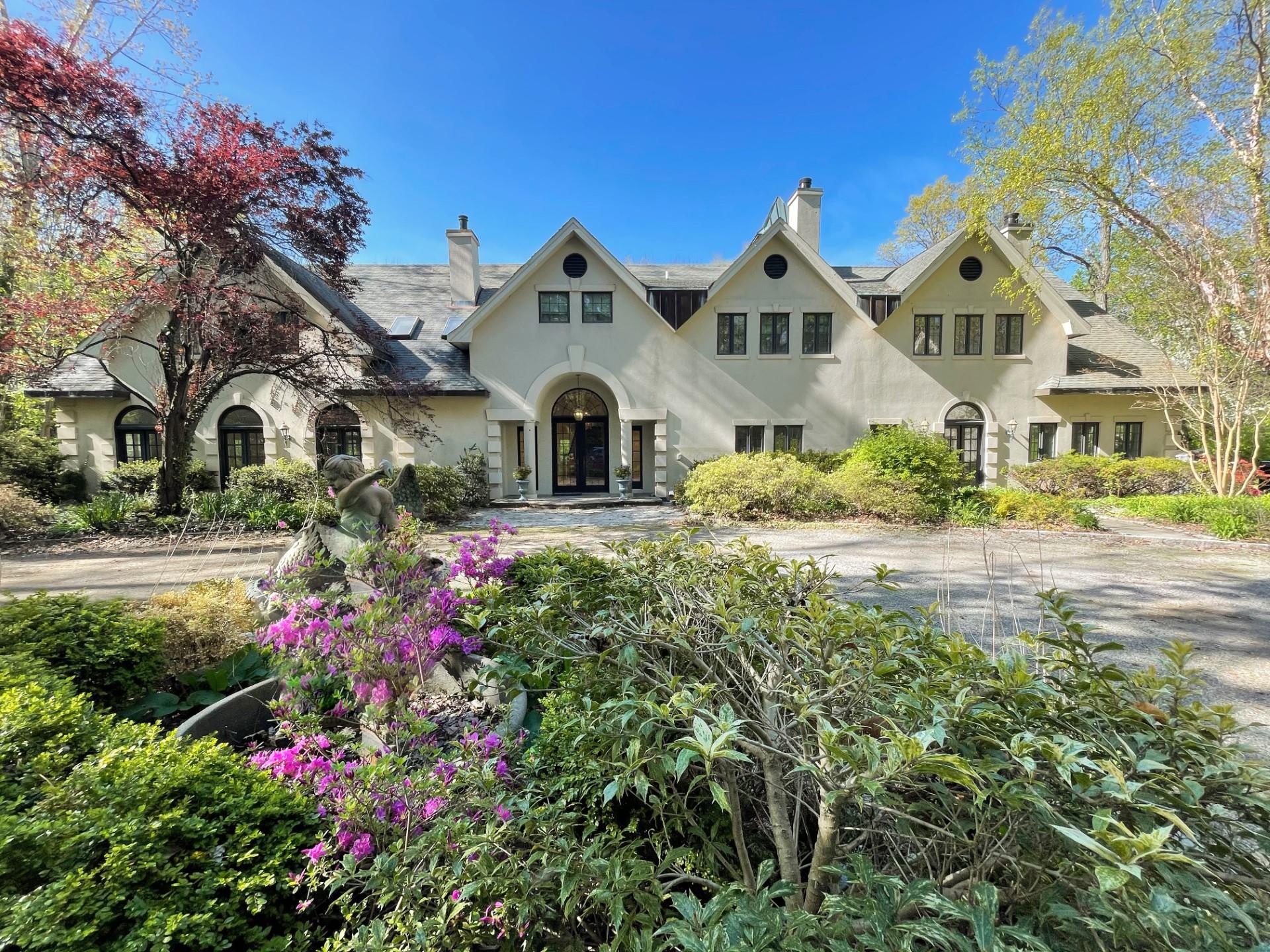 358 Centre Island Road Centre Island, NY 11771 - Photo 2 of 39 a front view of a house with a yard and fountain