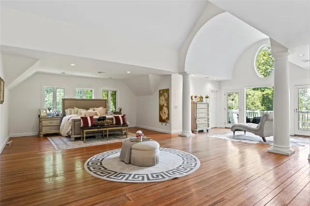 a living room with furniture window and wooden floor