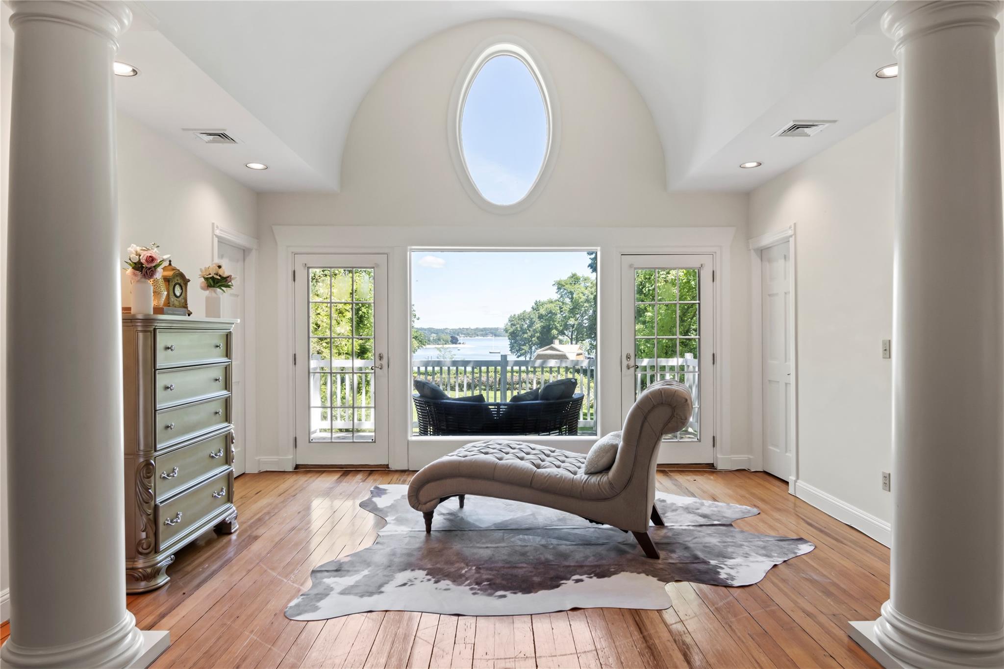 358 Centre Island Road Centre Island, NY 11771 - Photo 23 of 39 a living room with furniture fireplace and a large window