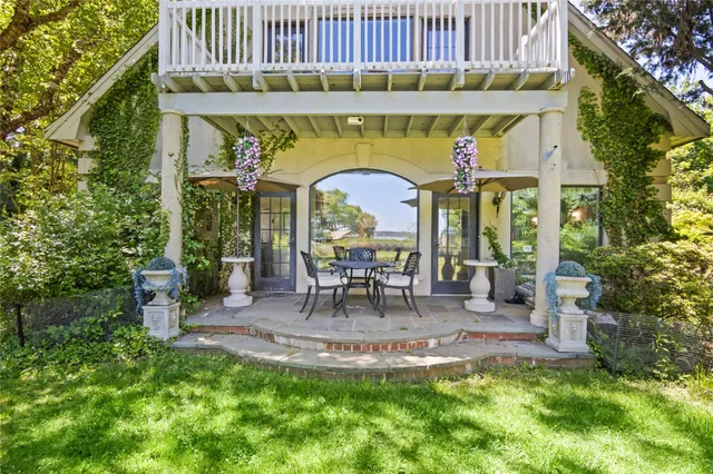a view of a chair and table of the house