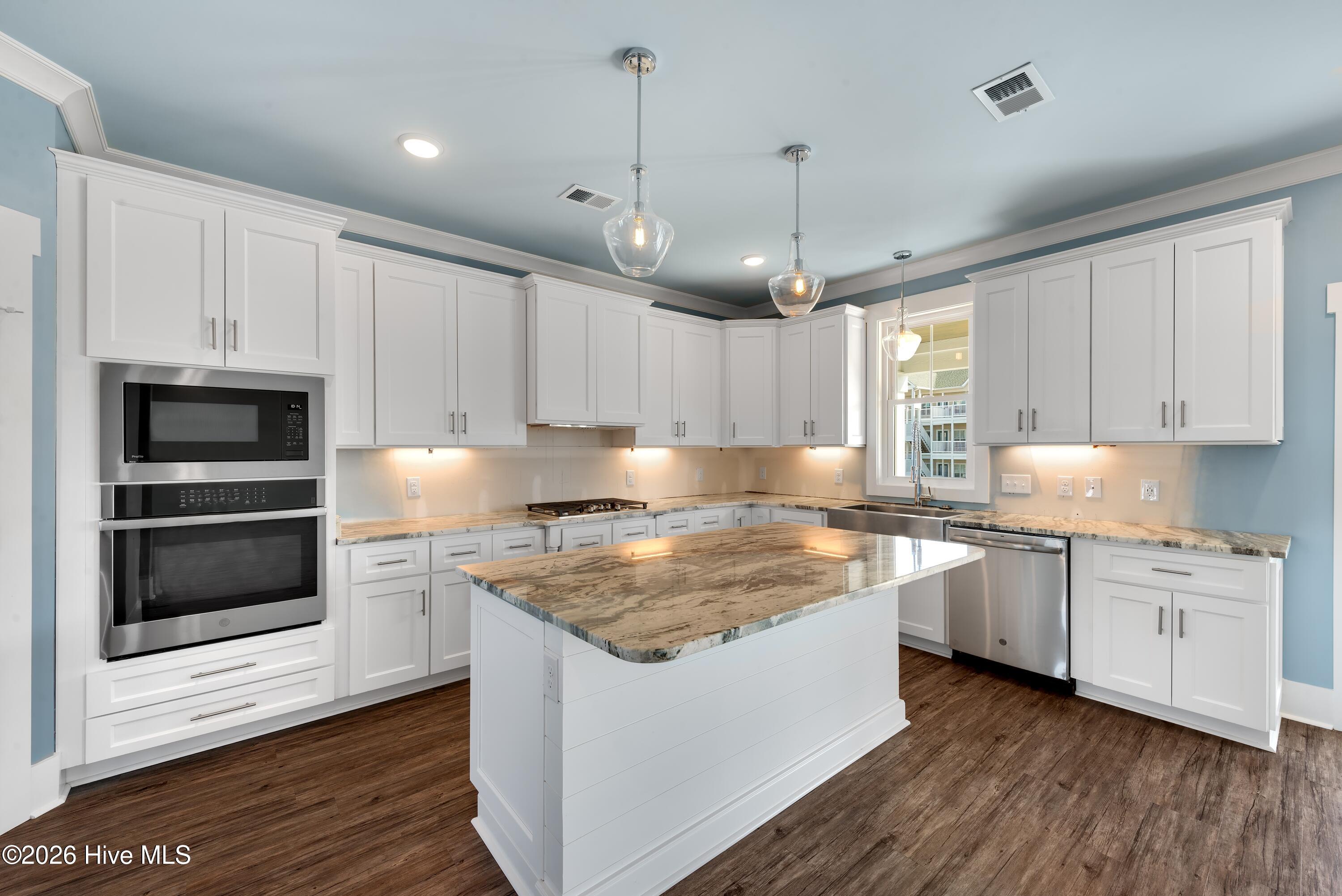 90 West First Street Ocean Isle Beach, NC 28469 - Photo 17 of 37 Another Island and Kitchen by Builder